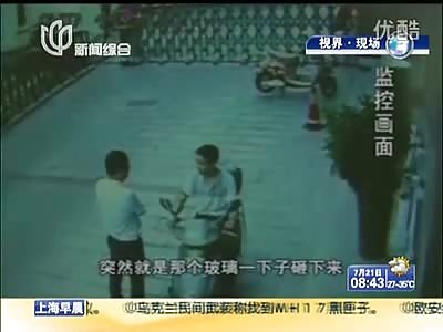 Horrible Way to Die... Man is Hit in the Head by a Falling Glass Sheet While Talking to his Buddy