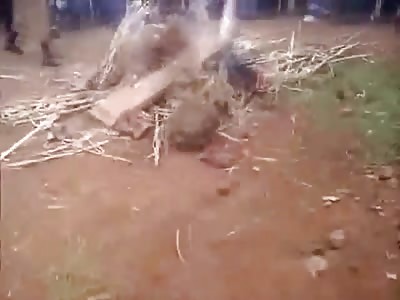 Squirming Thief Being Cooked Alive in Huge Bon Fire