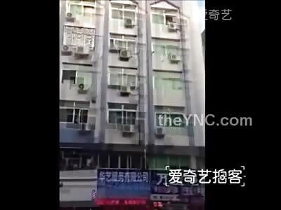 Depressed Woman in Purple Leaps to her Death (Includes Landing) 