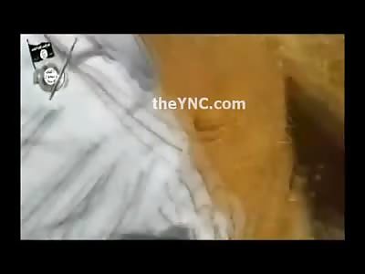 Squirming Man is Slaughtered by ISIS Member with a Knife 