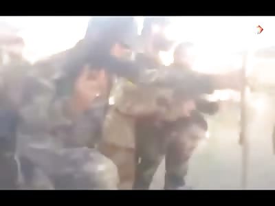 Soldiers Show Off Trophy Kill of Terrorist with His Head on a Spike