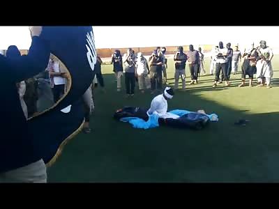 New Execution shows Blindfolded Man in White is Executed on Very Well Groomed Perfectly Green Grass