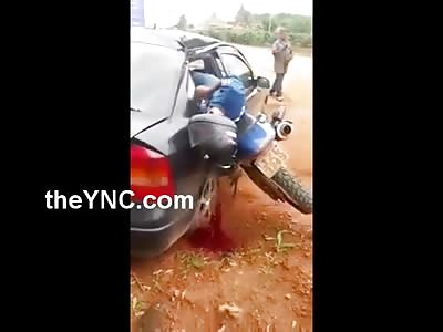 Rider and Bike Stuck inside Car