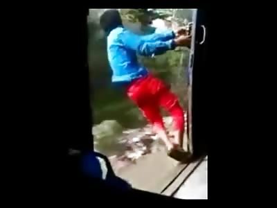 Crazy guy loses grip on train