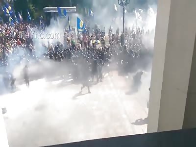 Guy Throws Grenade, It Lands Right At The Police Front Line Exploding Killing One, Injuring Many