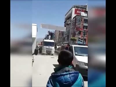 Biker Slides on Wet Asphalt and His Head is Crushed by Truck Wheel