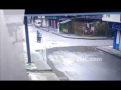 Biker flips in the air after being hit by car... lands on his ass and Head