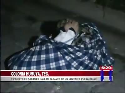 CORPSE FOUND WRAPPED IN SHEETS