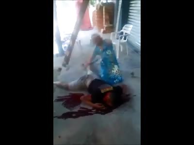 Older Woman Cries over her Dead Son 