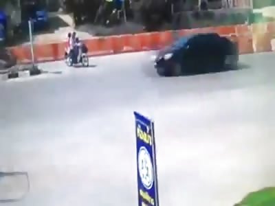 Couple on a Scooter Struck by Car