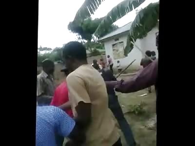 Scared man be Beaten with Sticks