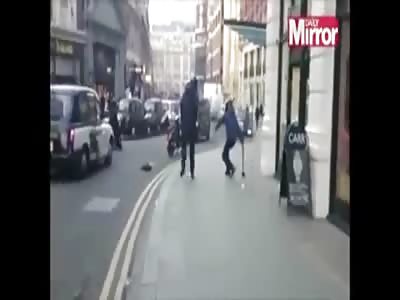 Crazy bastards try to stop machete wielding robber.