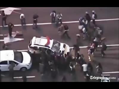 CHAOS: Brazil hooligans set fire on MOVING cars after lost World Cup game TODAY (08/07)