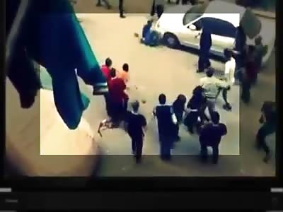 MAN STABBING WIFE IS STONED BY POPULATION