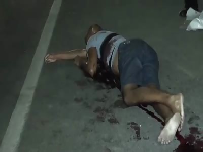 FOUND DEAD IN THE STREET: BODY RIDDLED WITH BULLETS