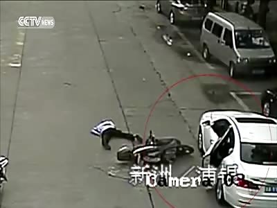 CYCLIST FRACTURES LEG AFTER RAMMING INTO OPEN CAR DOOR