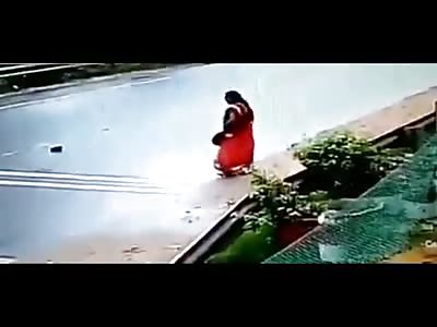 LADY HIT BY A CAR WHILE PICKING UP SHOE