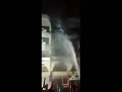 TRYING TO ESCAPE FIRE, WOMAN JUMPS FROM BUILDING AND DIES