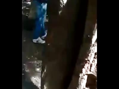 MURDERED MAN'S BODY IS FOUND IN SHALLOW GRAVE