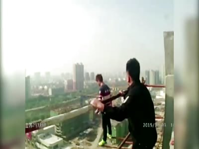 POLICE SAVES SUICIDAL MAN FROM 60M-HIGH BILDING