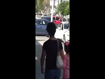 WOMAN OVER HUSBAND'S CAR PREVENTS HIM TO GO AWAY WITH LOVER