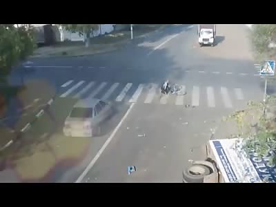 Lucky Cyclist survives Crash at Intersection