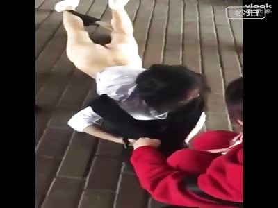 Woman stripped bottomless by others in public 