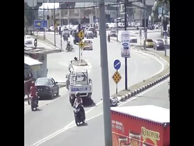 Motorcycle crushed truck