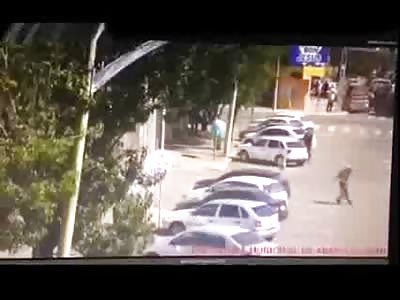 Idiot throwing rocks at car