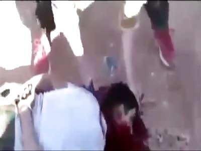 Two Syrian soldiers are beheaded.  Head is Twisted Off...