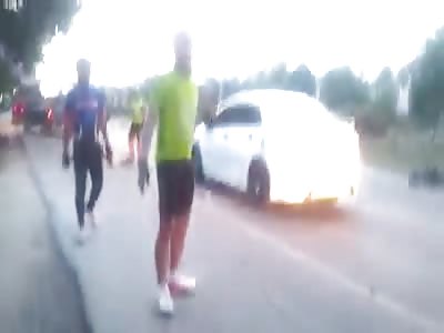 Car slams into cyclists