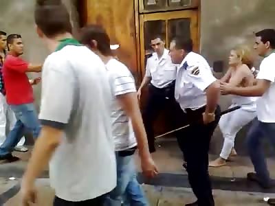 police officer's beer belly & colombiana's boobs flop out while they fight in the street