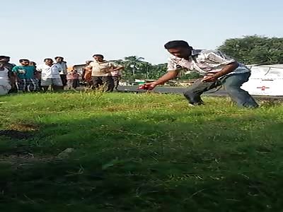 Man Collecting Remains of a Guy Crushed into Pieces by a Truck With Bare Hands