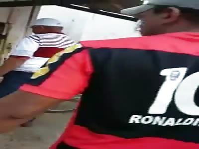 woman stabbed and bleeding in a market in brazil