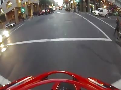 Cyclist gets hit by a car and lands on his feet