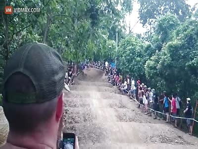 Spectator grabs a pro's bike and tries to ride down the Australian UCI World Cup course.... it doesn't end well
