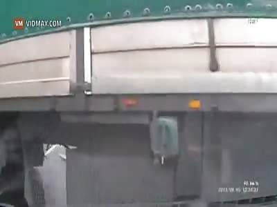 Car comes within inches of become road pizza.