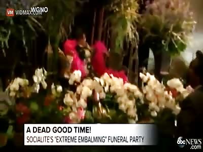 Deceased Socialite Gets Propped up Posing in Pink Boa at Her Memorial Service.