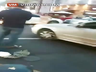 Crazy naked Korean lady jumps on random car.