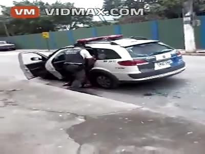 Police Brutality to the extreme! Brazilian Police beat this Topless hooker bloody putting her in the car