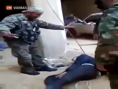 ISIS Fighters brutally beat a man, then lights his head on fire